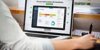 person using QuickBooks software