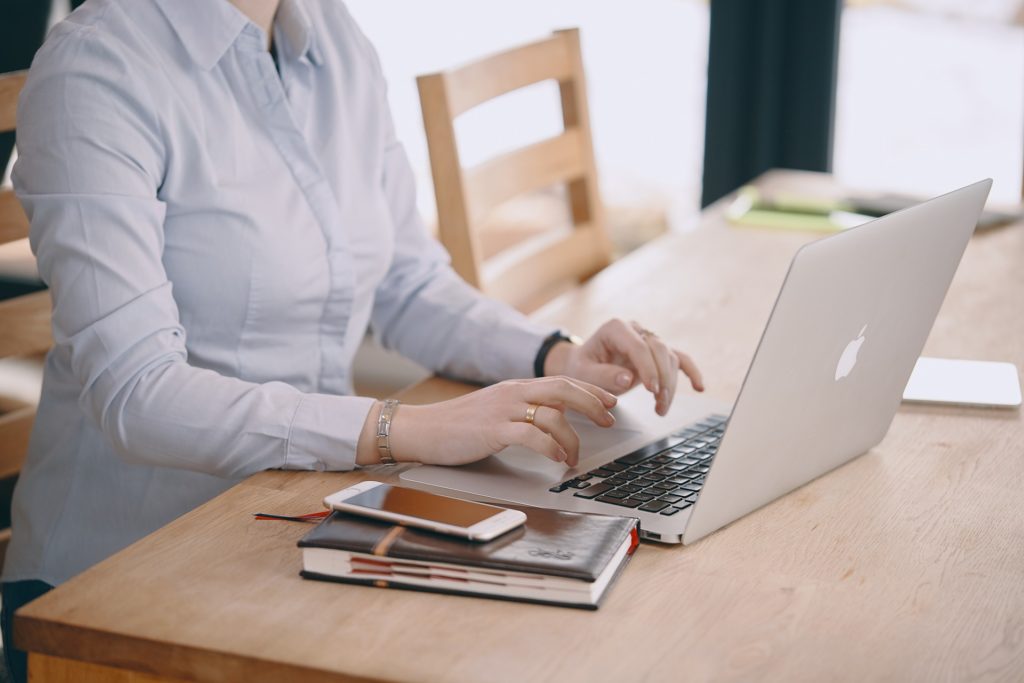 Woman working in front of a laptop