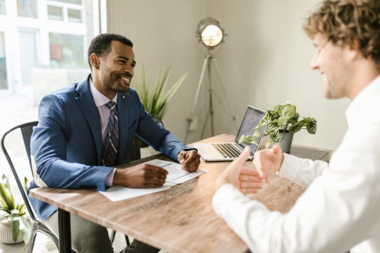 Two business owners discussing about QuickBooks Payments