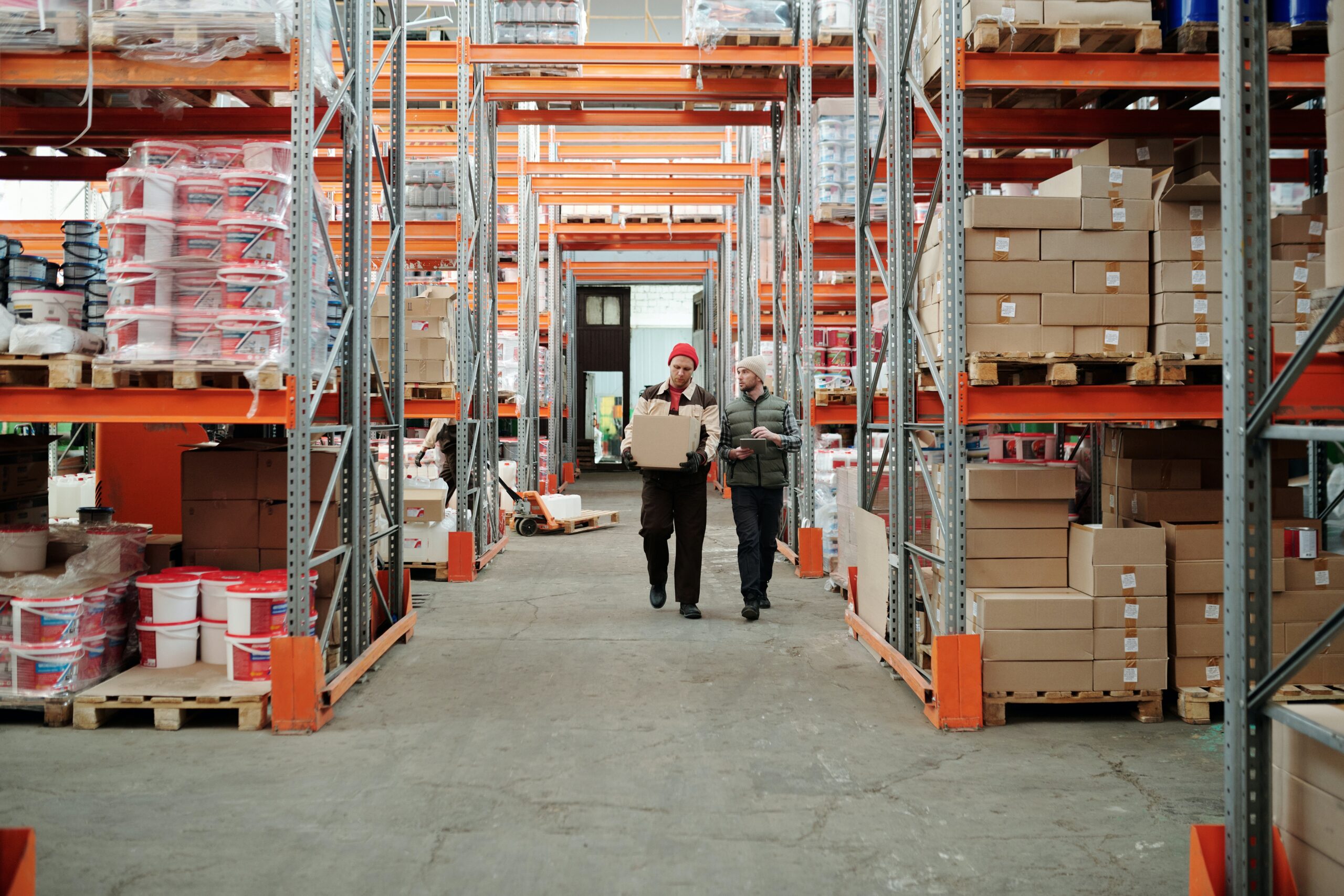 Supervisors overseeing inventory in a warehouse