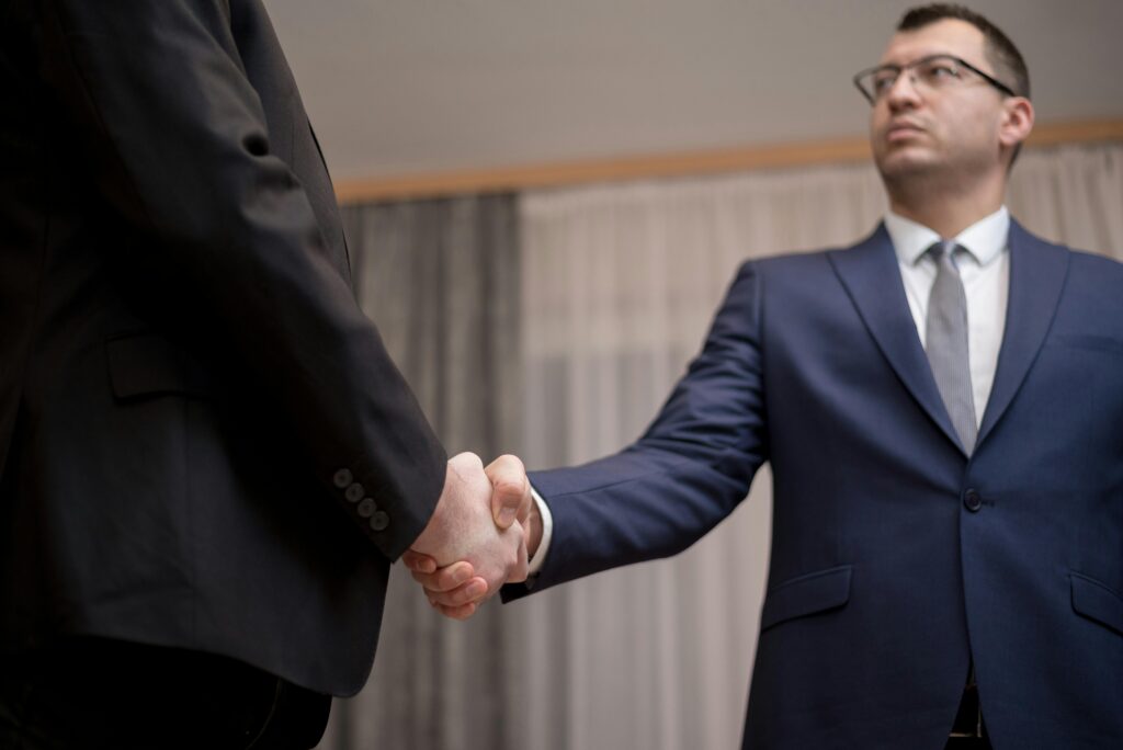 Two business leaders shaking hands