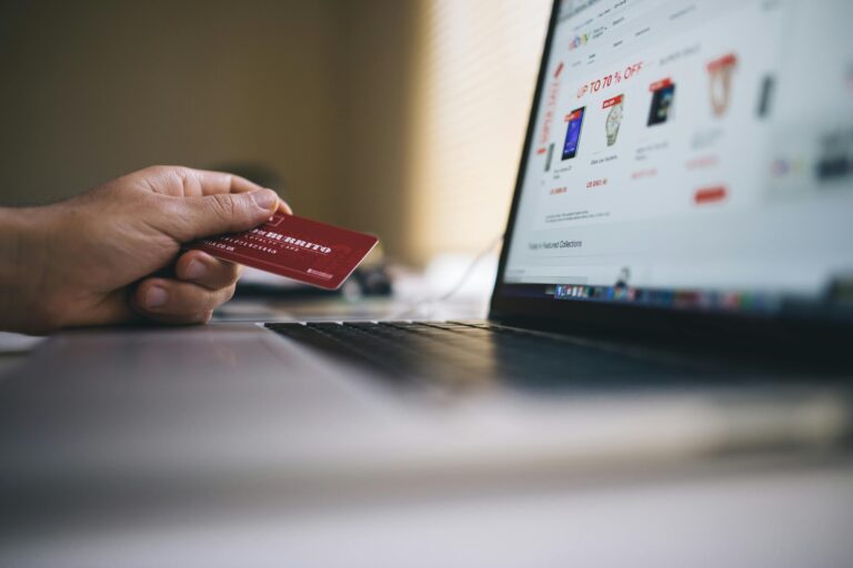 Credit card shown in front of a laptop