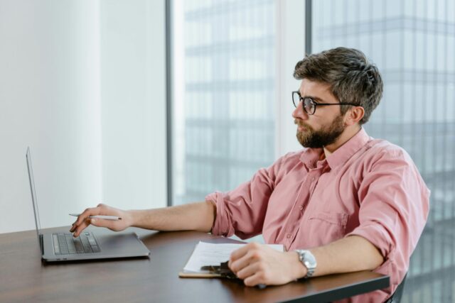 Businessman checking out consolidated reports in QuickBooks Enterprise