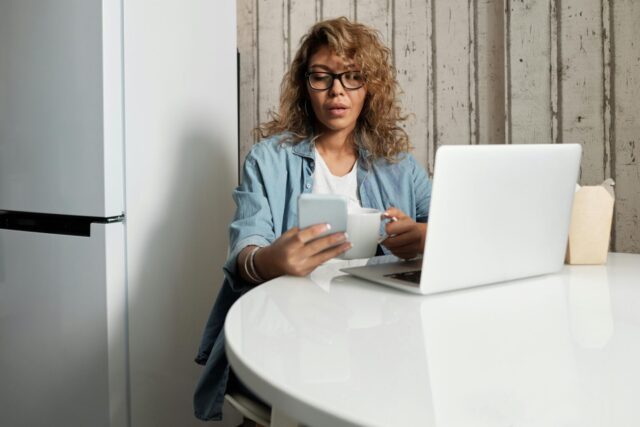 Business owner accessing QuickBooks via her mobile