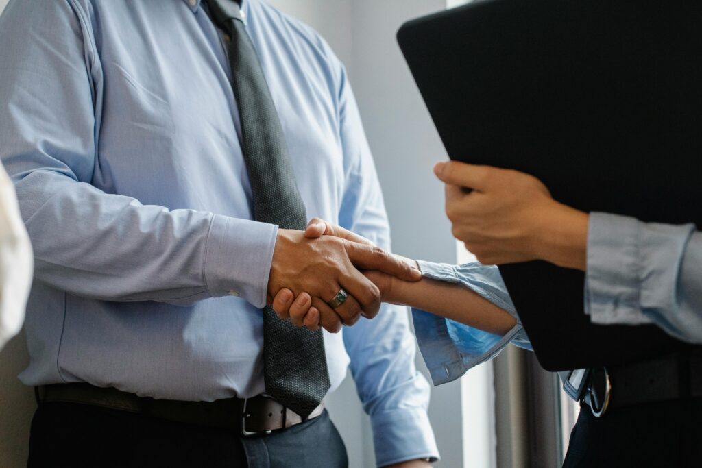 Businessman shaking hands with a QuickBooks reseller agent for a free trial