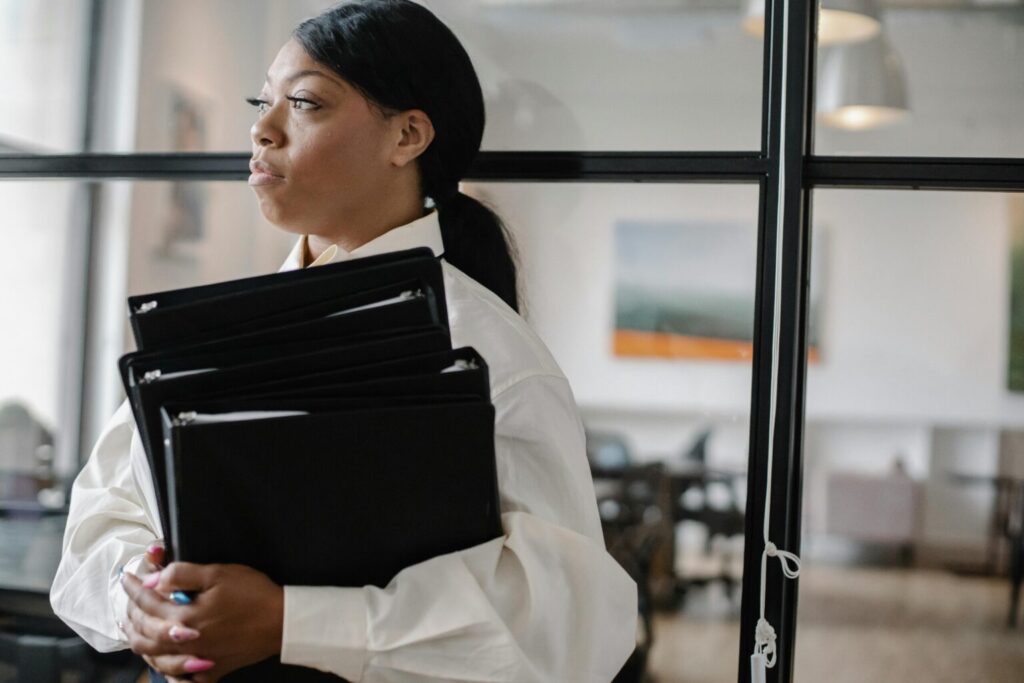 An accountant holding file documents