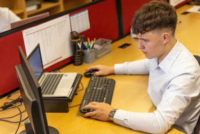 QuickBooks Online users working on a laptop