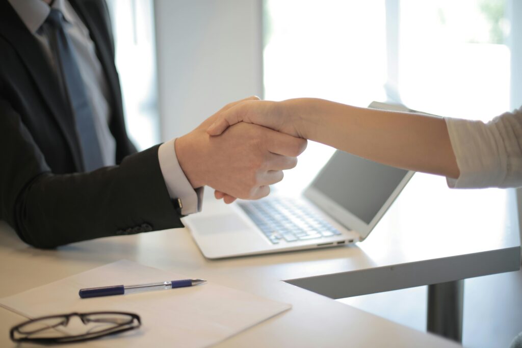 Shaking hands after a deal is closed