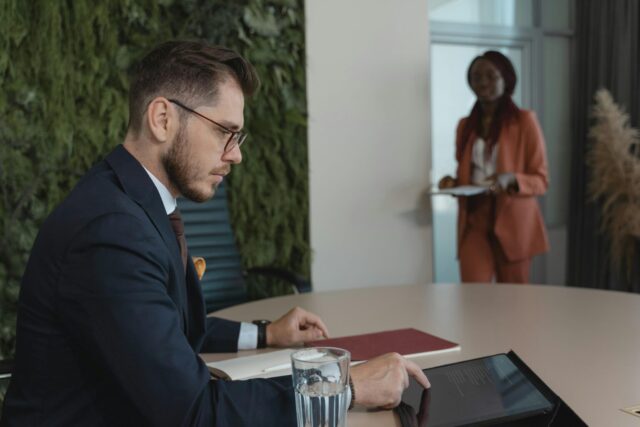 Businessman checking something on his tablet