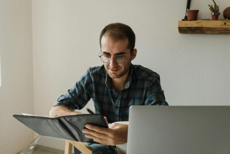 Businessman checking a customer payment portal